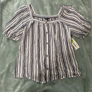 Blue and white shirt sleeve blouse.